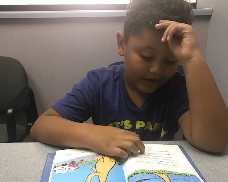 Breydon practices reading at the Fort Wayne Center for Learning.
