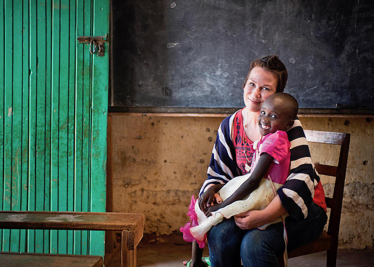 Denise DeMarchis, the late founder of Matilda Jane Clothing, holds Nancy, a child she sponsors in Kenya.