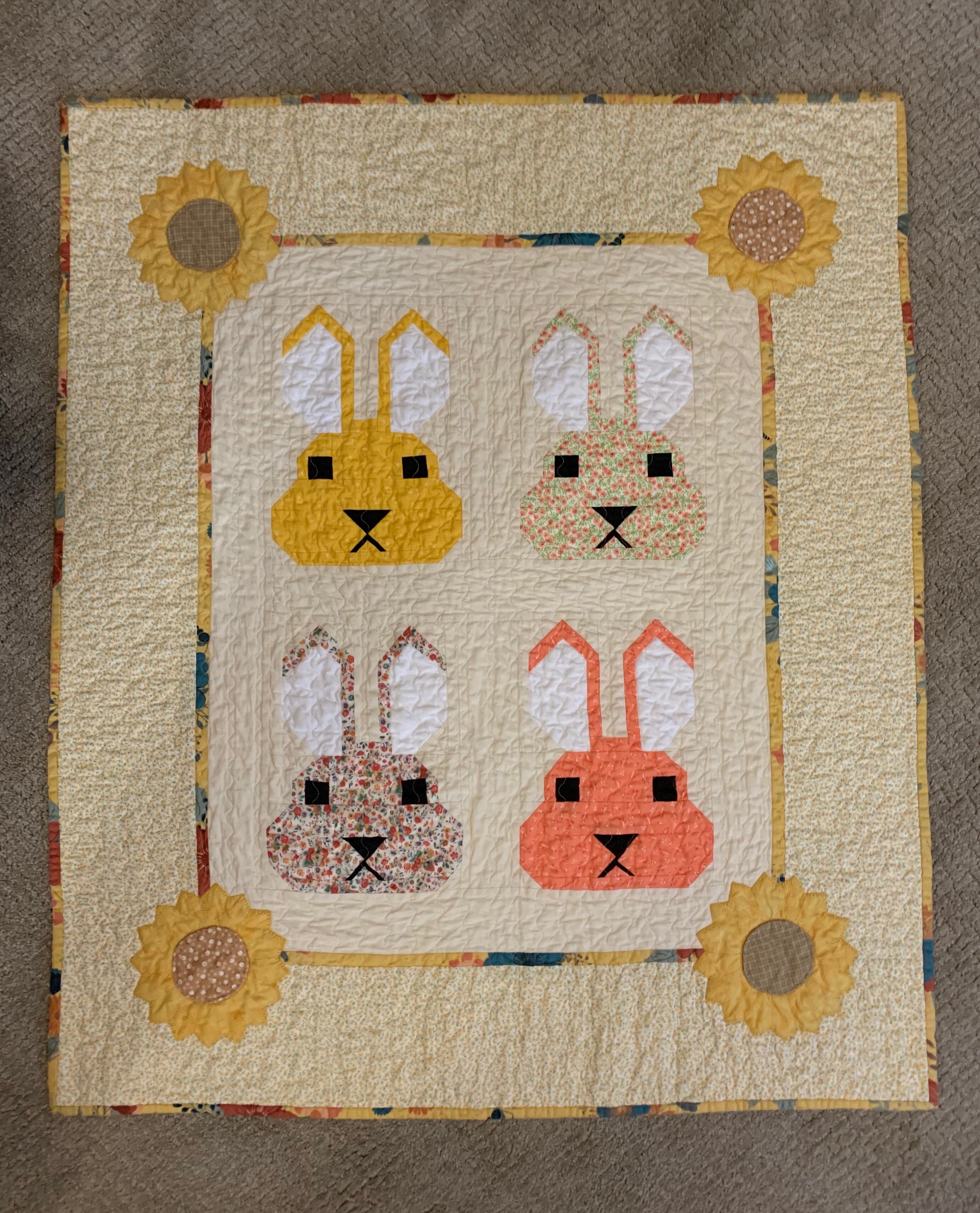A baby quilt made by Christine Paul.