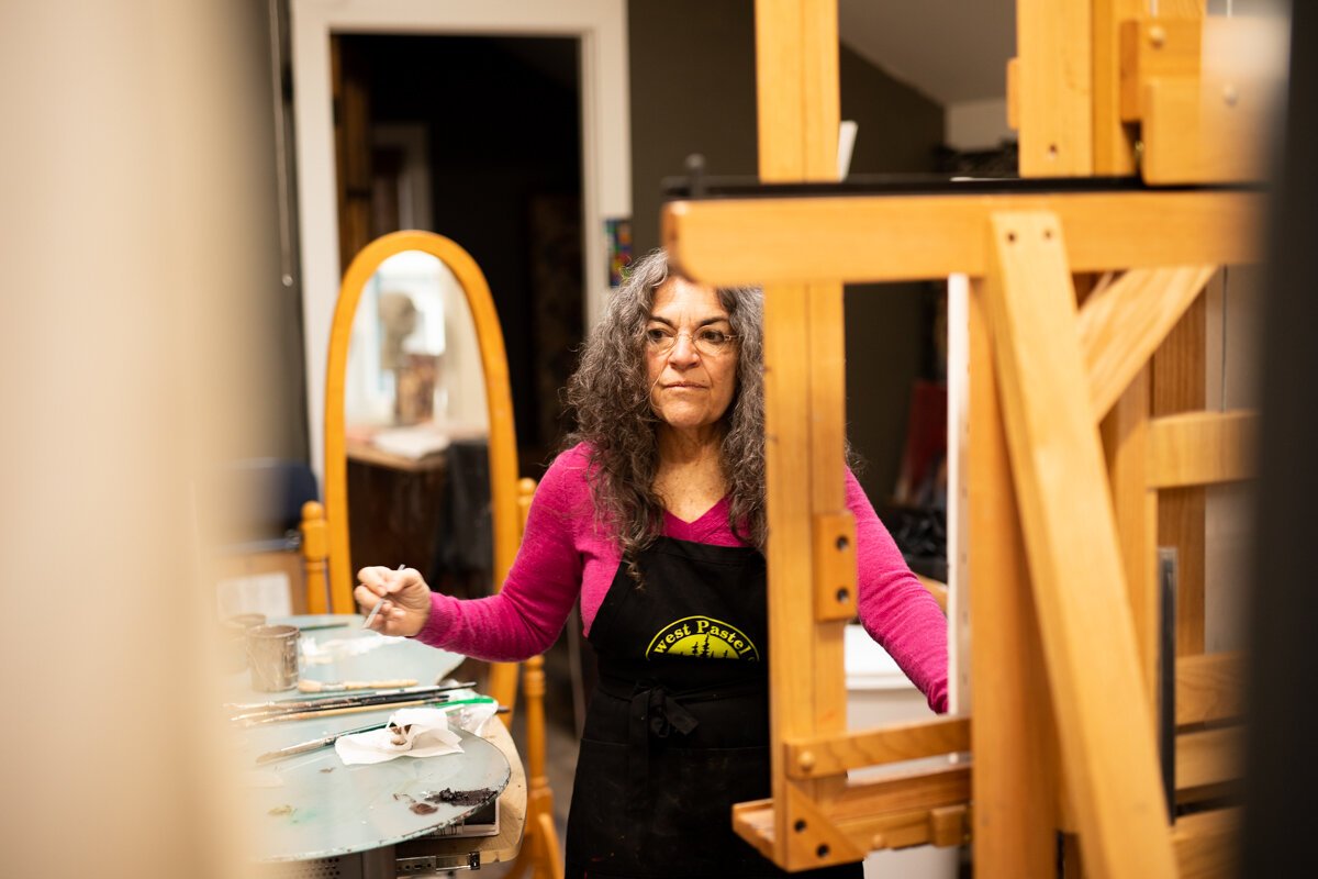 Hilarie Couture, a former street artist, paints in her home studio in Williams Woodland Park of Fort Wayne.