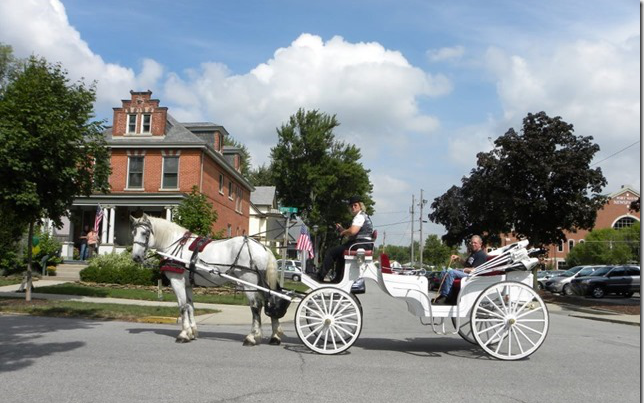 Complimentary horse-drawn carriage rides are part of the Home and Garden Tour experience.