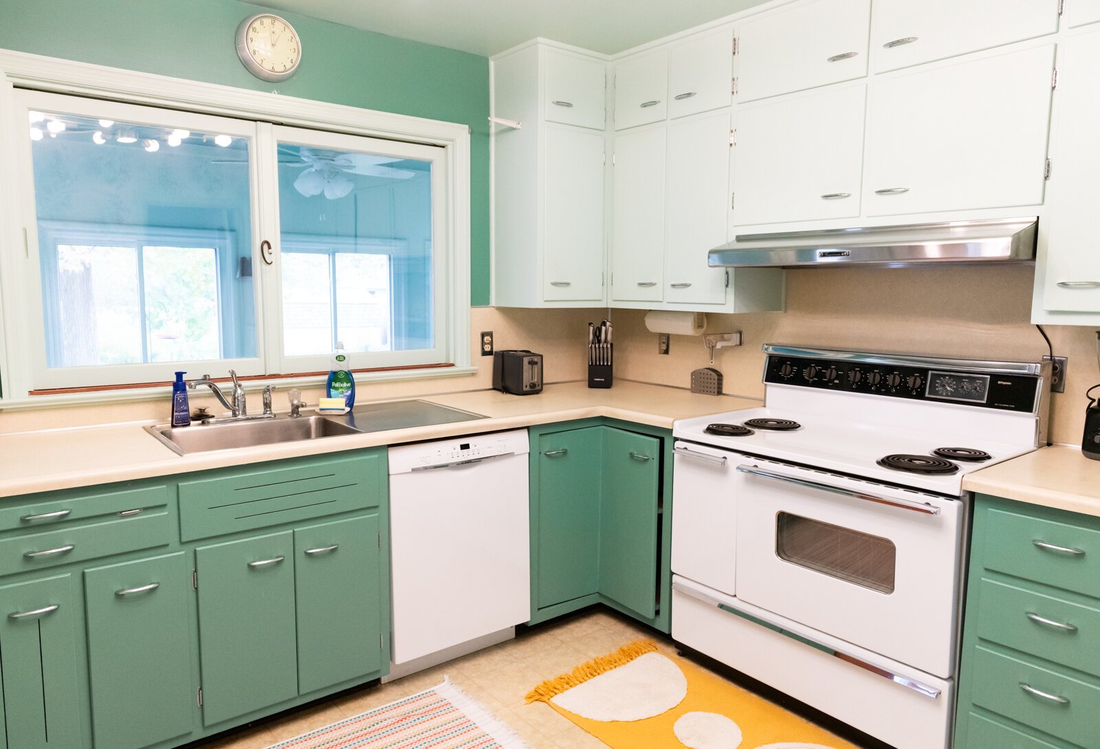 The kitchen feature mint green cabinets.