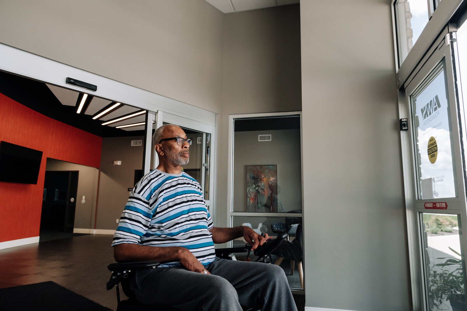Clif Wallace showcases the extra wide doors suitable for wheelchairs while at the AWS Foundation.