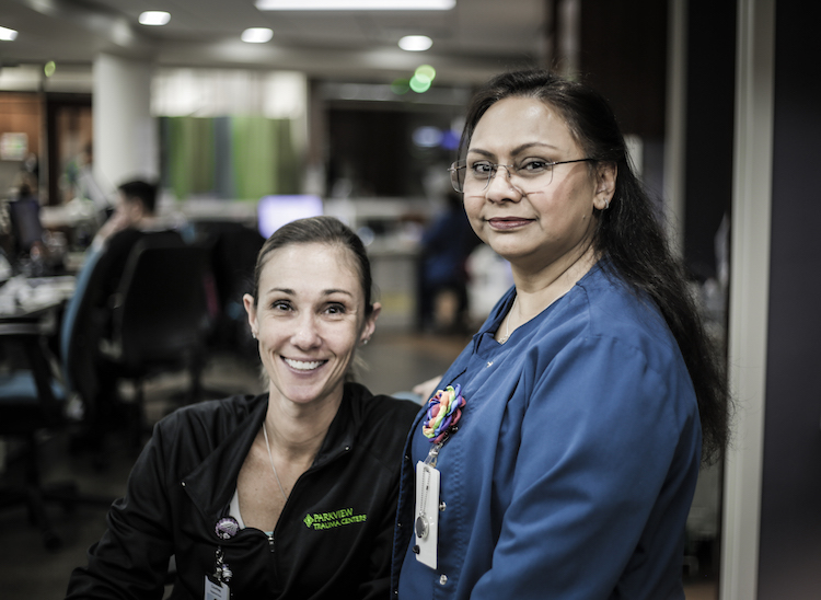Courtney Goeglein, left, a RN, poses with Mahmuda Arman, right, a Post-Acute Admission Liaison Nurse.