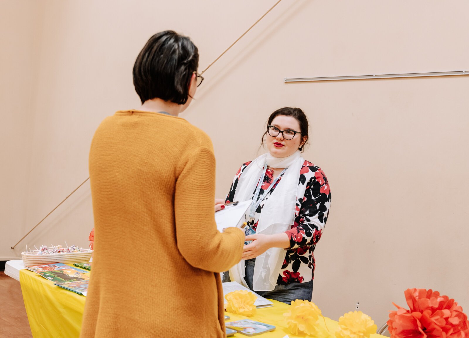 Bernadette Fellows, Community Engagement Planner with the City of Fort Wayne, right, talks with Jessica Porter, who is a member of the church during the Fall Fest event at Harvester Missionary Church.