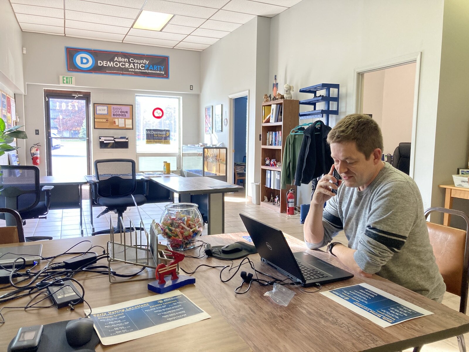 Chad Wiershinzki, Executive Director of Allen County Democrats, makes a phone call at party headquarters at 7301 Decatur Rd.