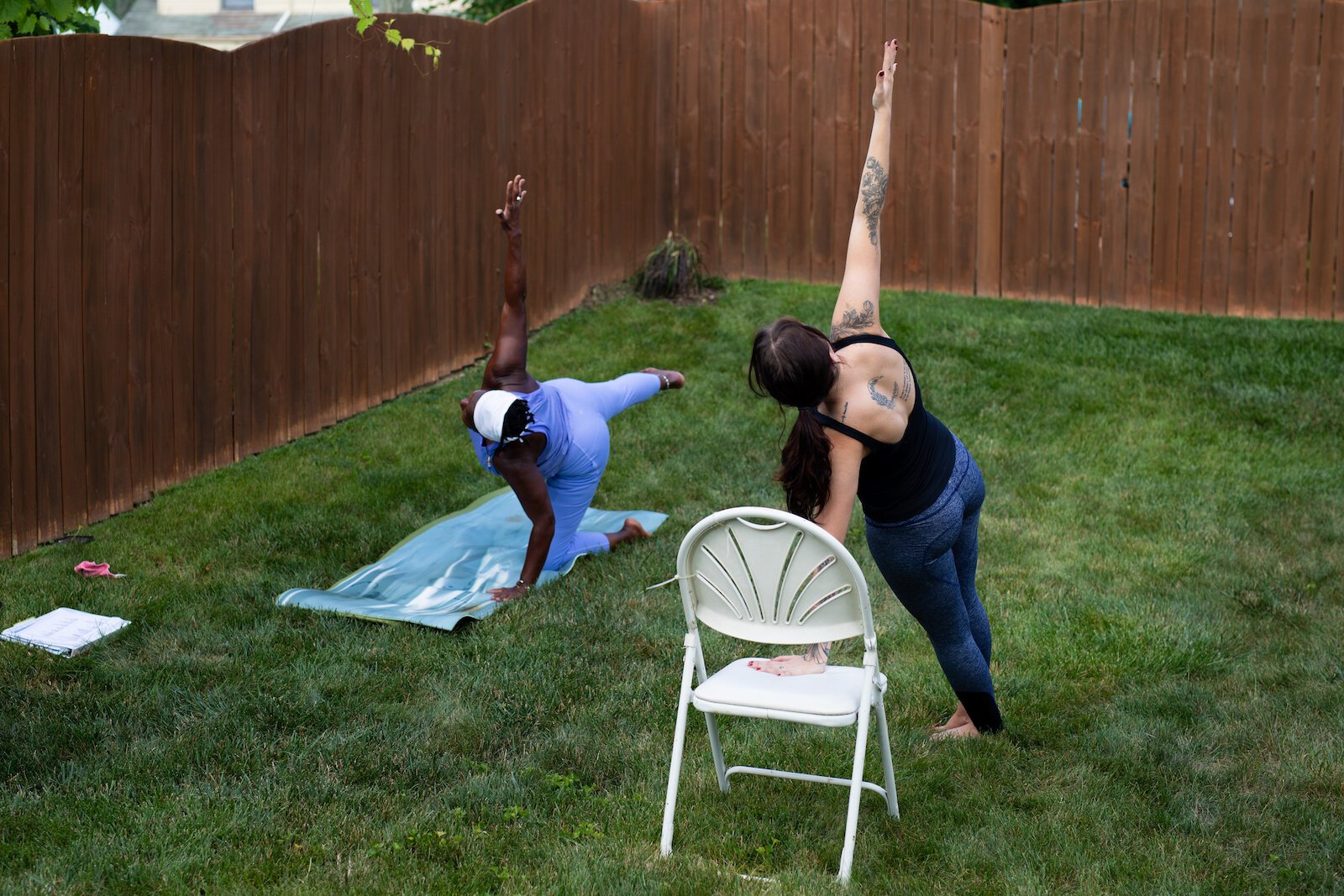 Diane Rogers, left, and Haley Evans, right, lead an inclusive, outdoor yoga class for Rooted Connection, LLC.