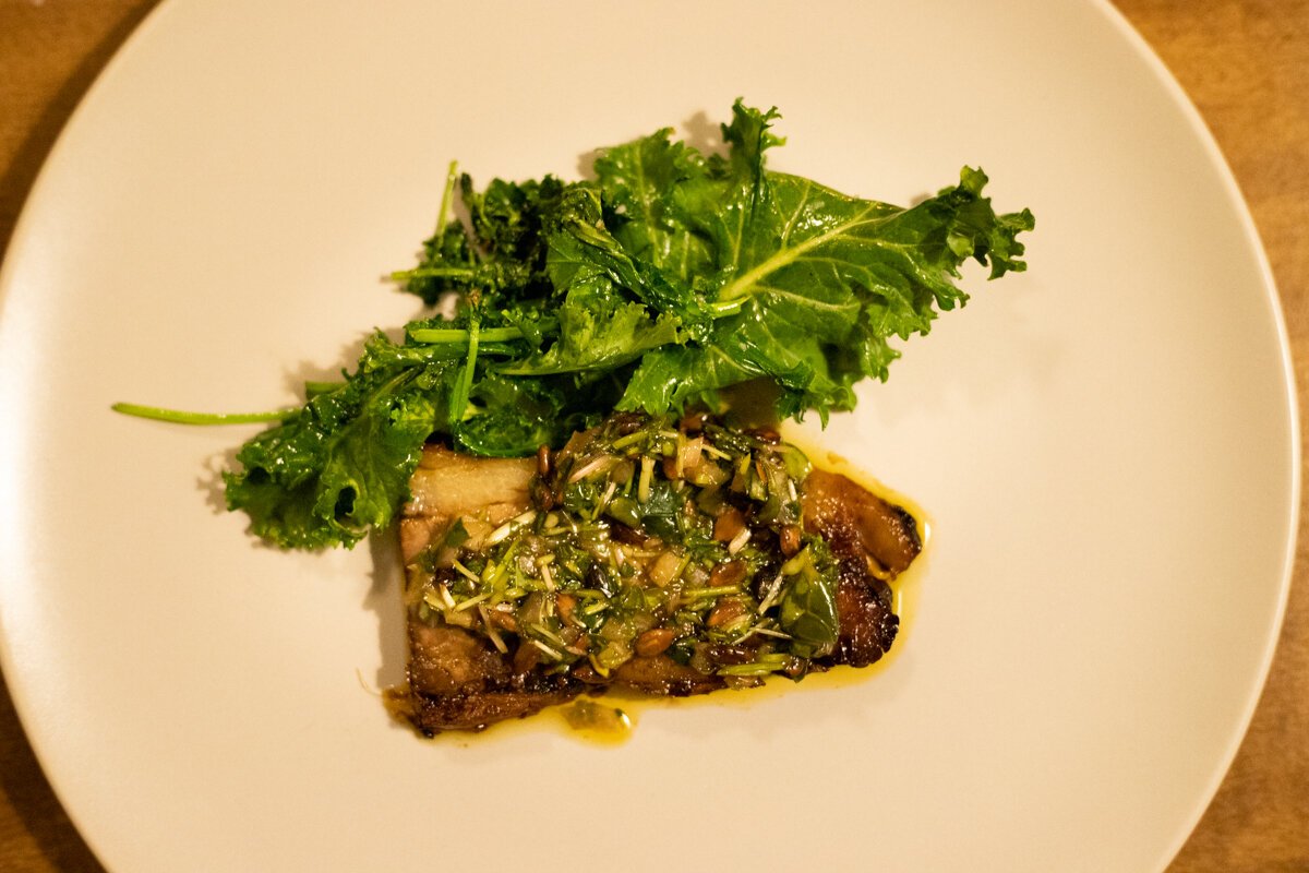The sixth course features a rich, succulent brisket cooked in a garlicky, chili-forward pinakurat.