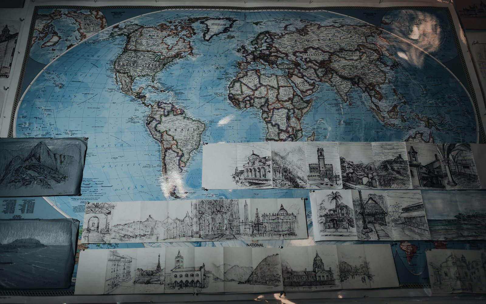 A map and sketches decorate a wall in Peter Lupkin's studio.