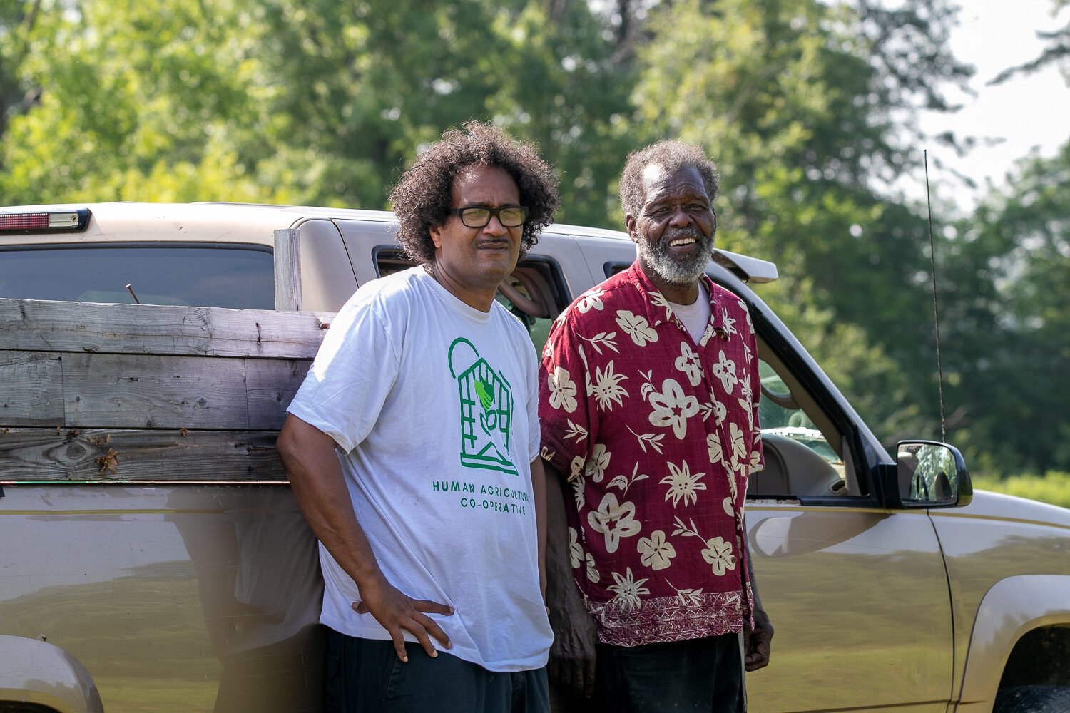 Ty Simmons, left, of the Human Agricultural Cooperative and Ephraim Smiley, right, of Smiley’s Garden Angels tend the community urban farm at 2512 E. Tillman Rd.