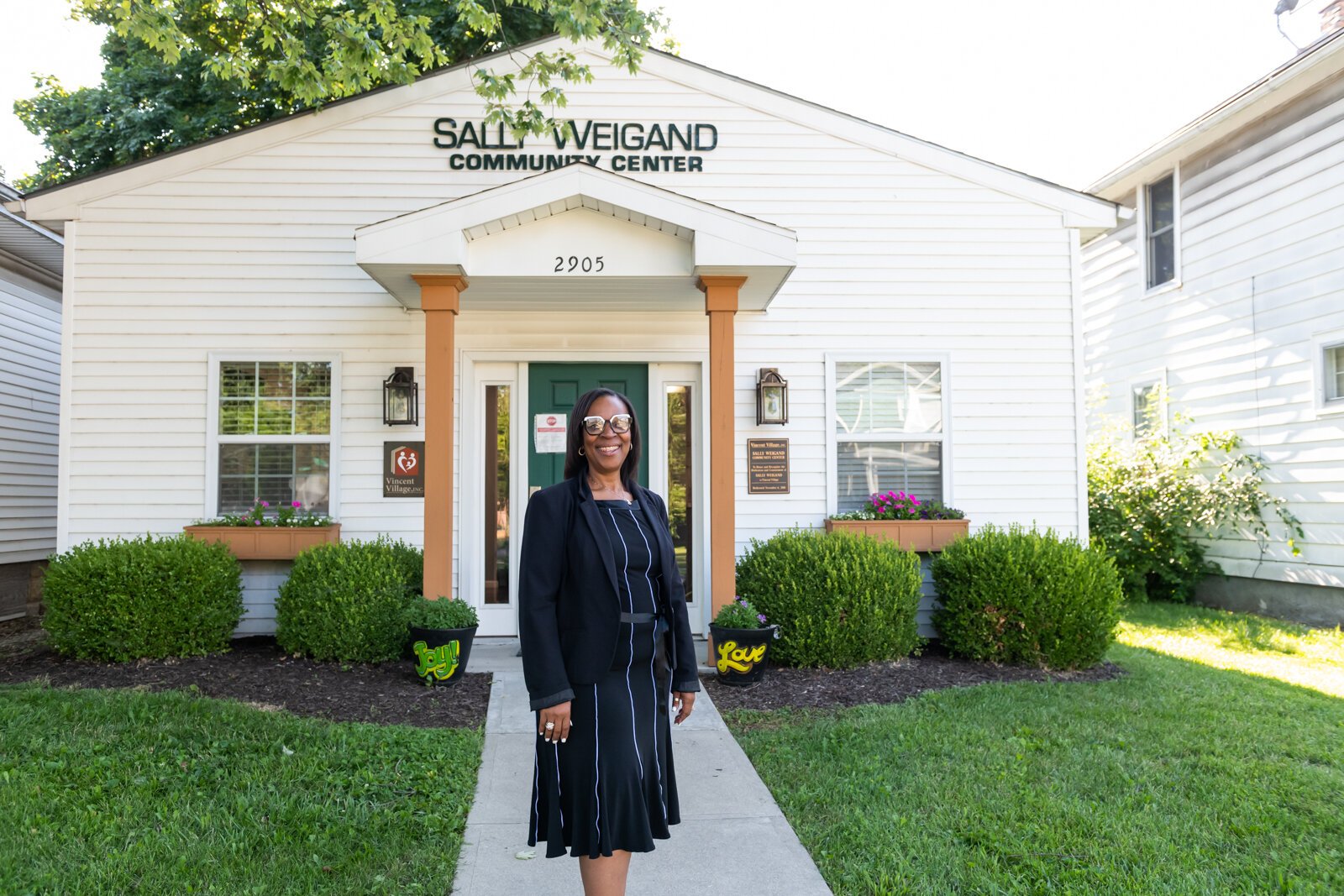 Sharon Tucker, Executive Director of Vincent Village, in front of the Sally Weigand Community Center.