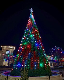  With shops lit up throughout the establishment, it is centered around a large Christmas tree that peeks above all of Jefferson Pointe with large lights and bulbs.