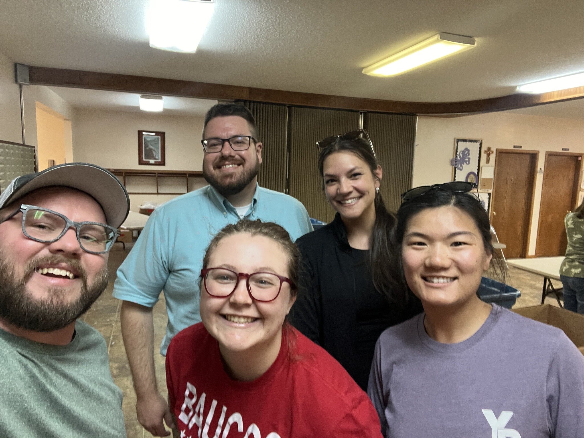 Young Professionals volunteer to pack Bash Bags. 