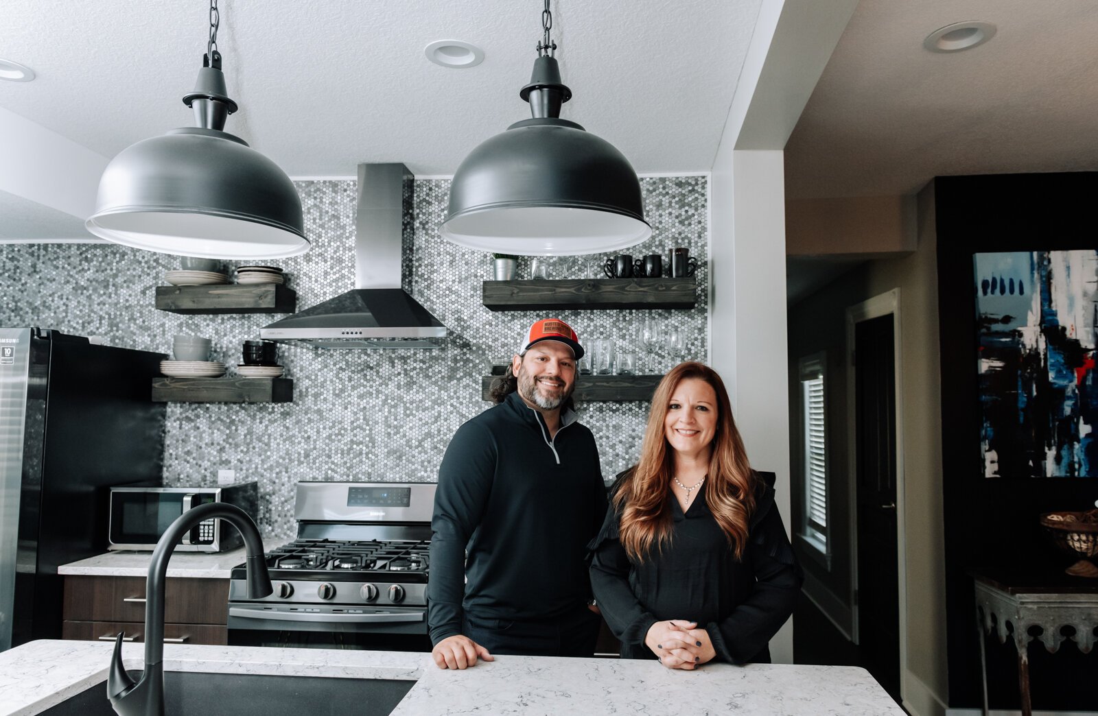 Alex Haggard, property owner, and Katrina Nichols, property manager in the top floor of their Airbnb on Fairfield Avenue in Downtown Fort Wayne.