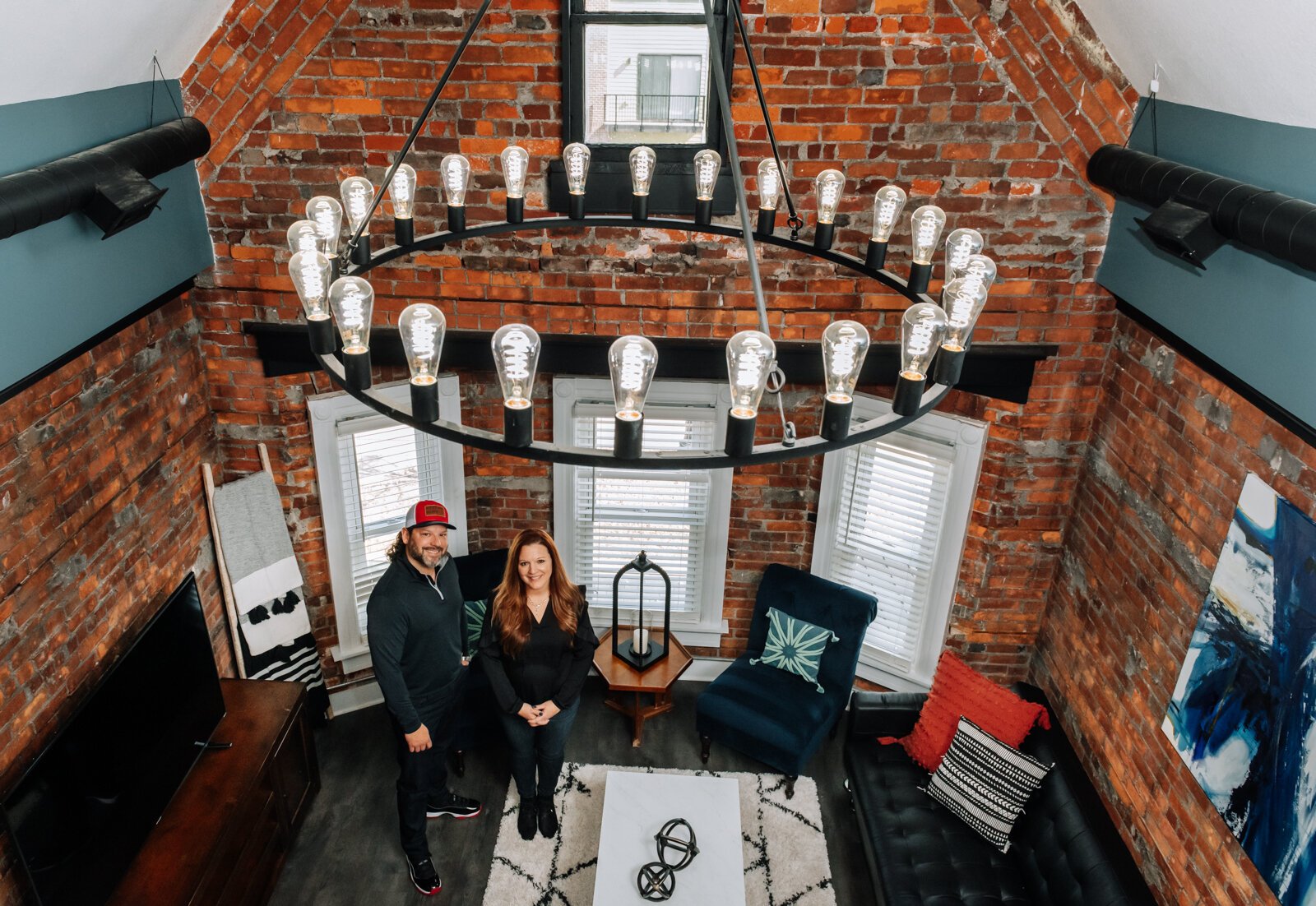 Alex Haggard, property owner, and Katrina Nichols, property manager in the top floor of their Airbnb on Fairfield Avenue in Downtown Fort Wayne.