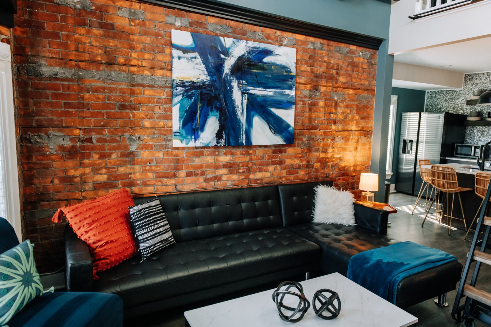 The living room area features local art from Jill Weikart.