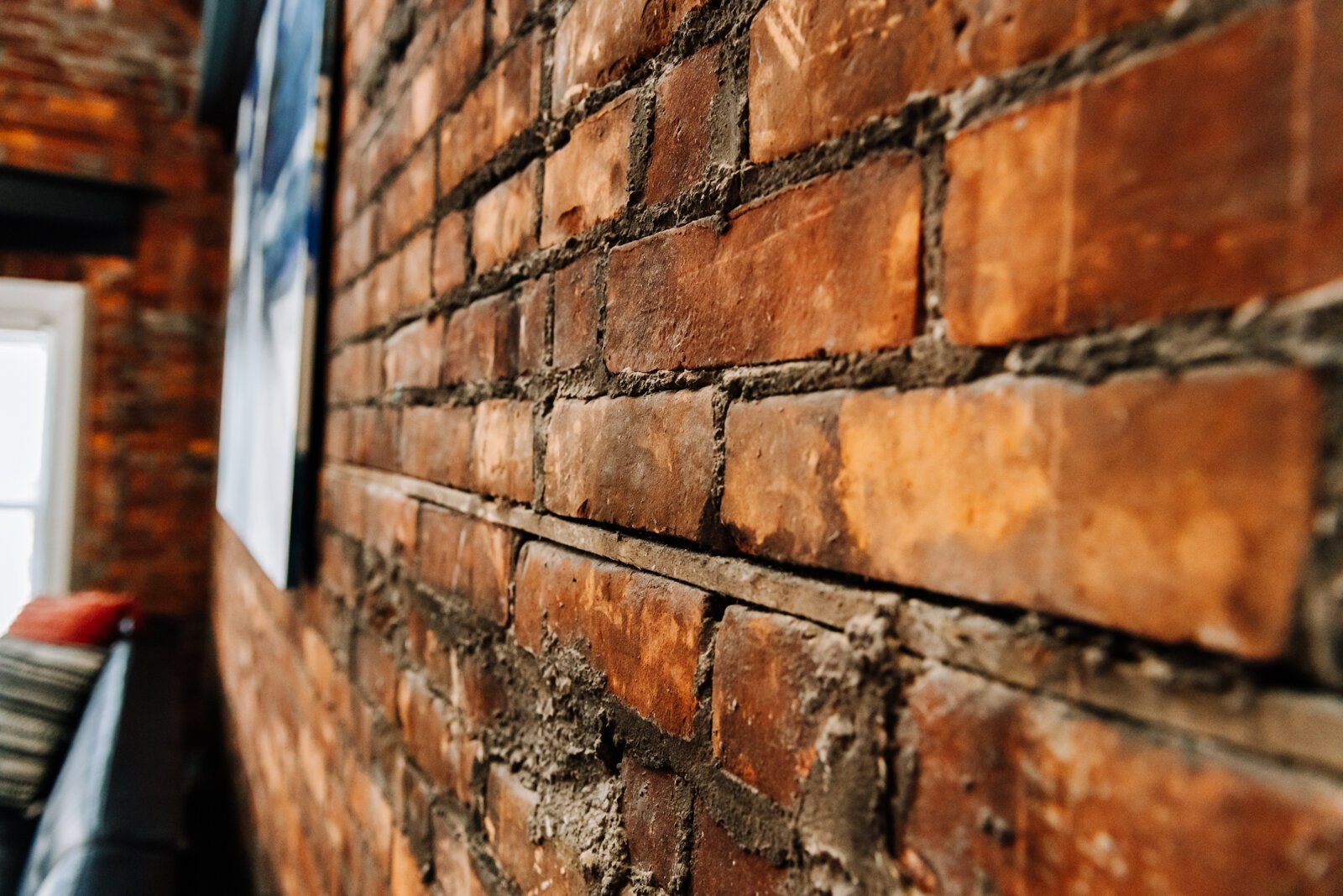 Exposed brick is a highlight of this Airbnb.