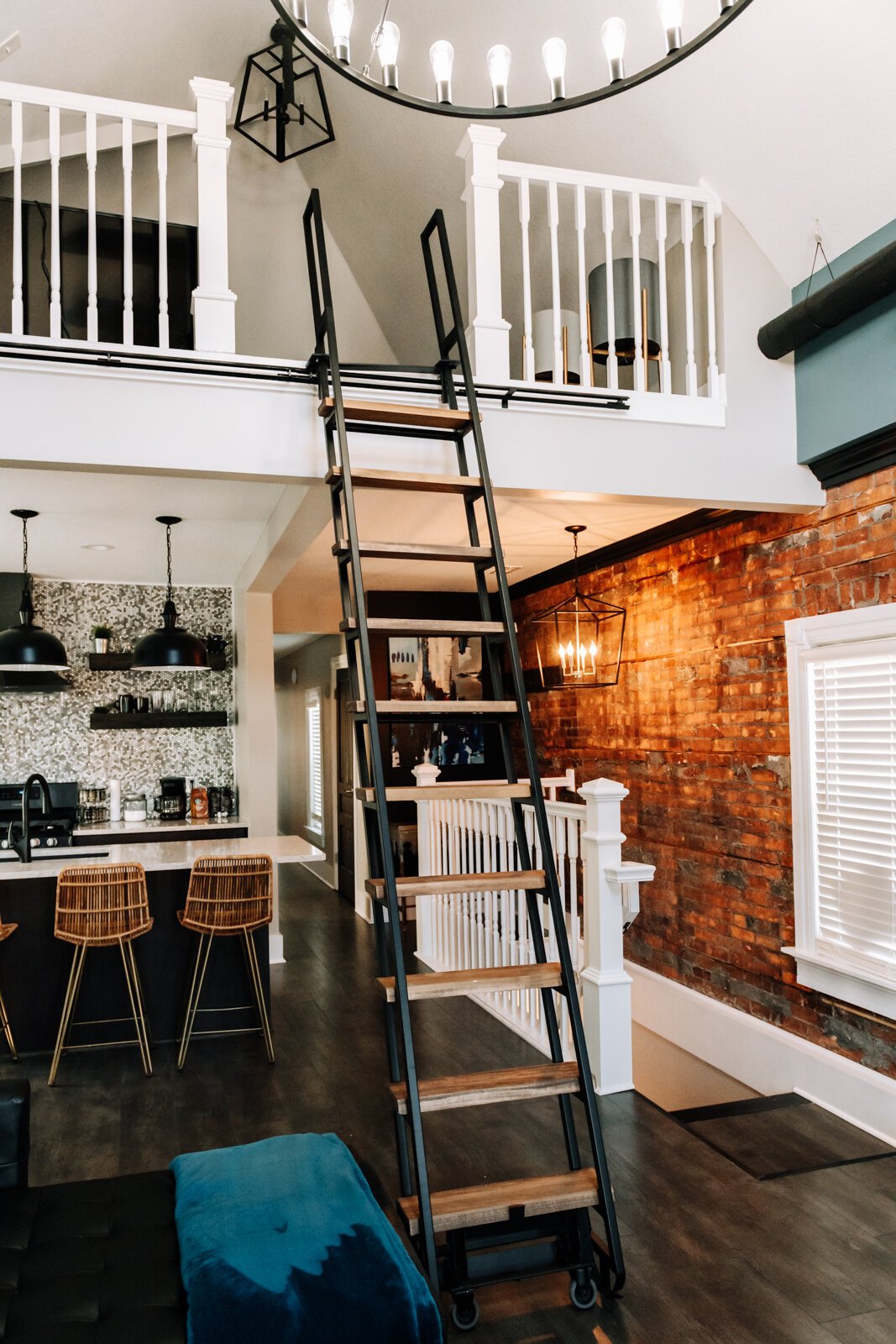 The stairs going up to the loft area on the top floor.