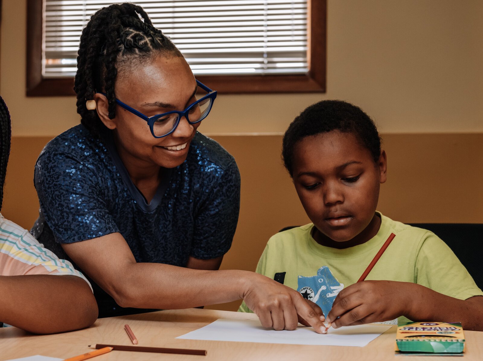 Alle Wims of Brain Geeks Learn educational services works with her student Charles during a private tutoring session at PENTA Center, 2513 S. Calhoun St.