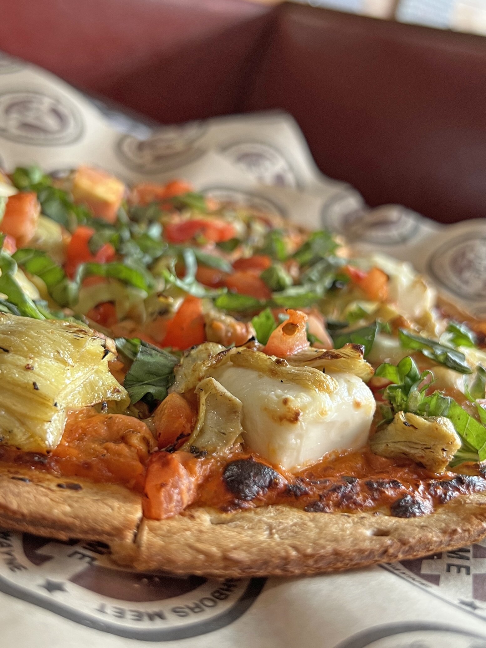 The cream cheese and garlic grilled artichoke pizza at ACME by Full Circle.