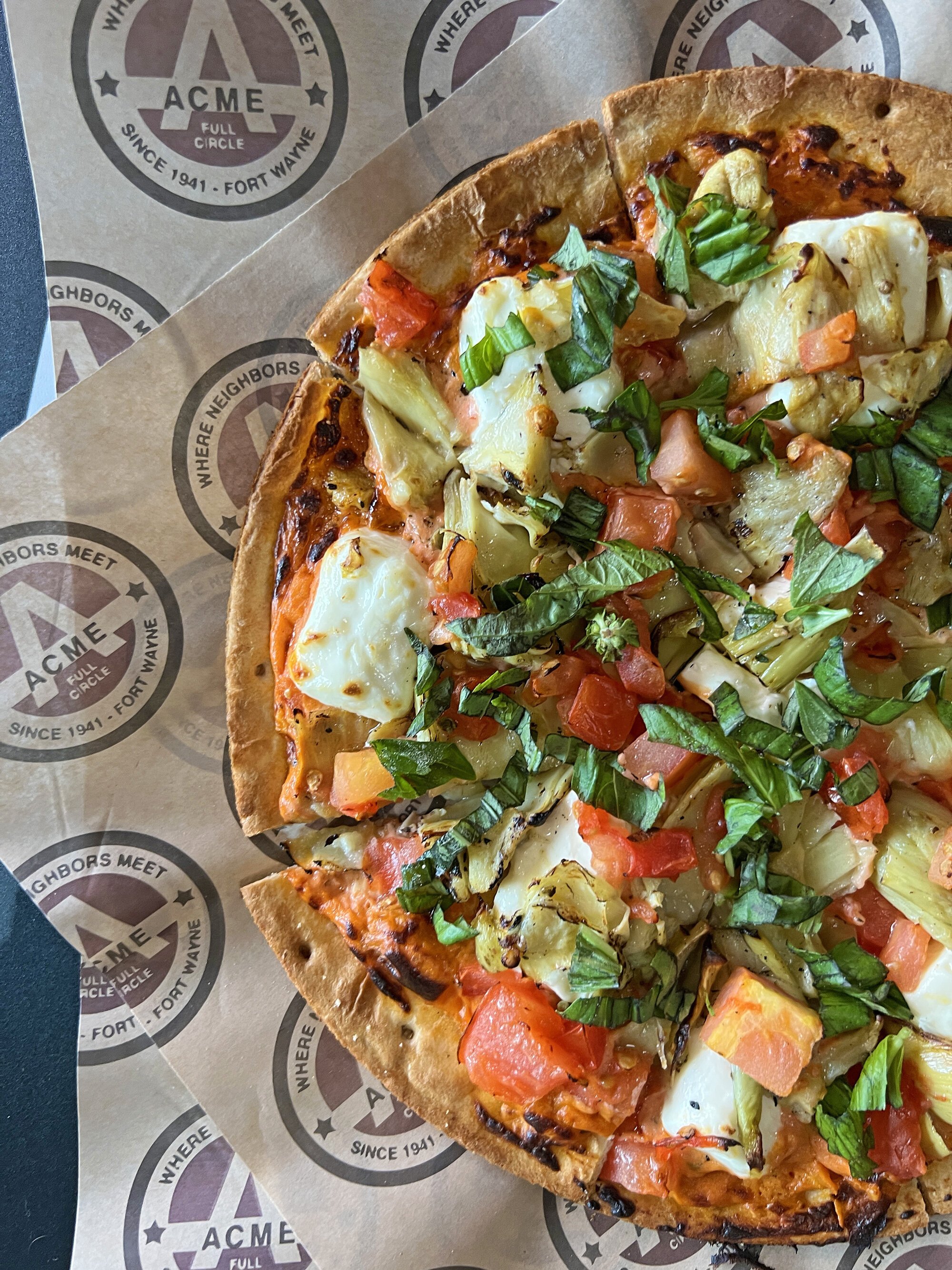 The cream cheese and garlic grilled artichoke pizza at ACME by Full Circle.