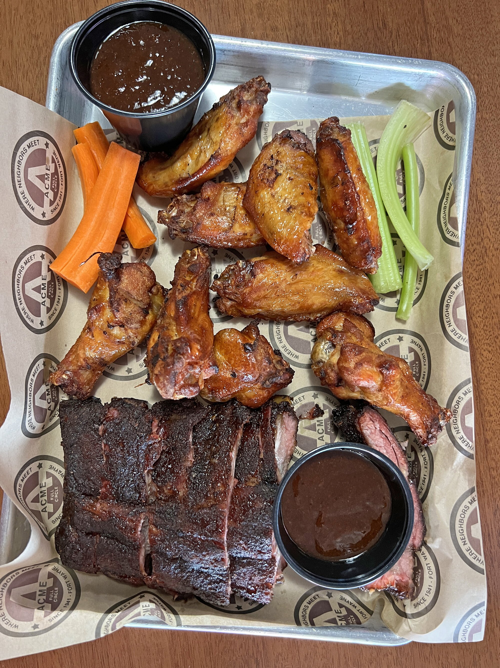 Smoked wings and baby back ribs from ACME by Full Circle BBQ.