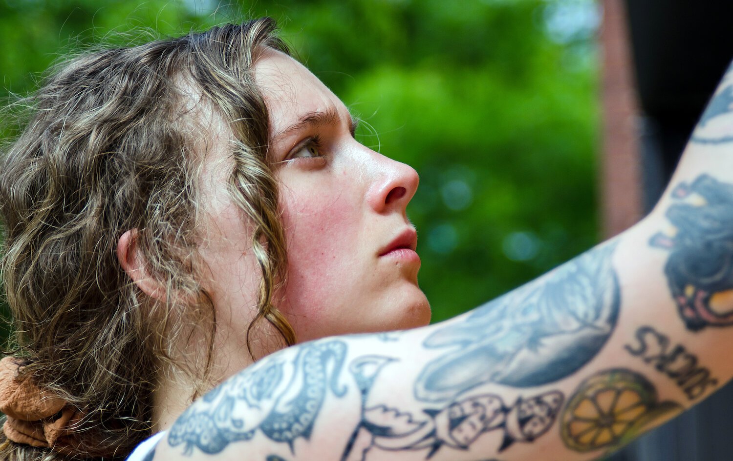 Adeline Griswold paints a mural in downtown Fort Wayne.