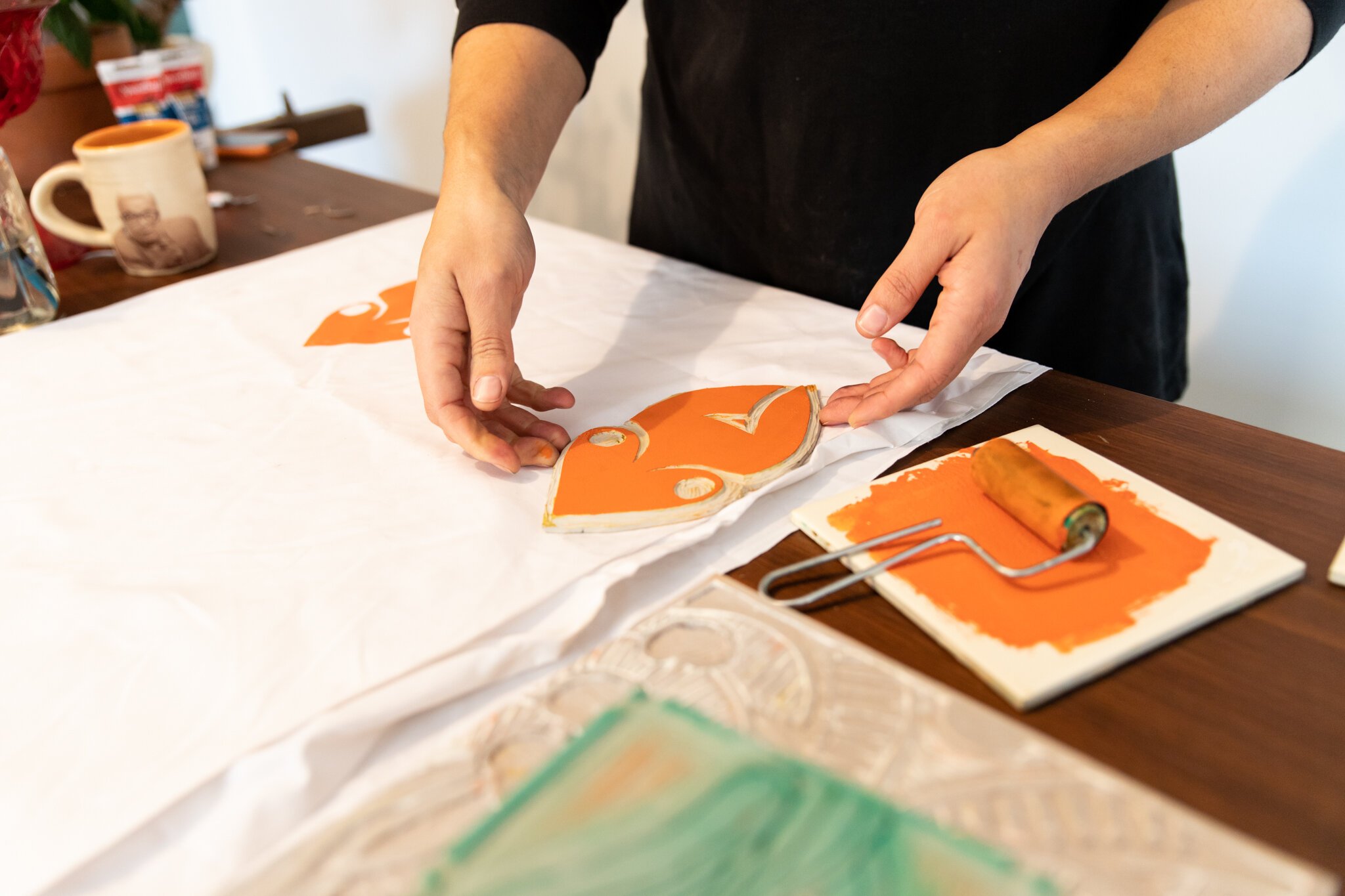 Fort Wayne Artist Lyndy Bazile using block printing to create her next piece.