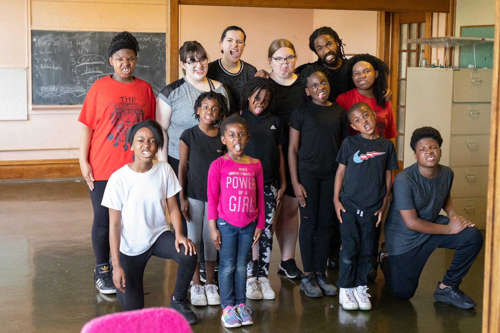 Mr. Curry, back right, poses with students at a June practice for the Art Leadership Center.