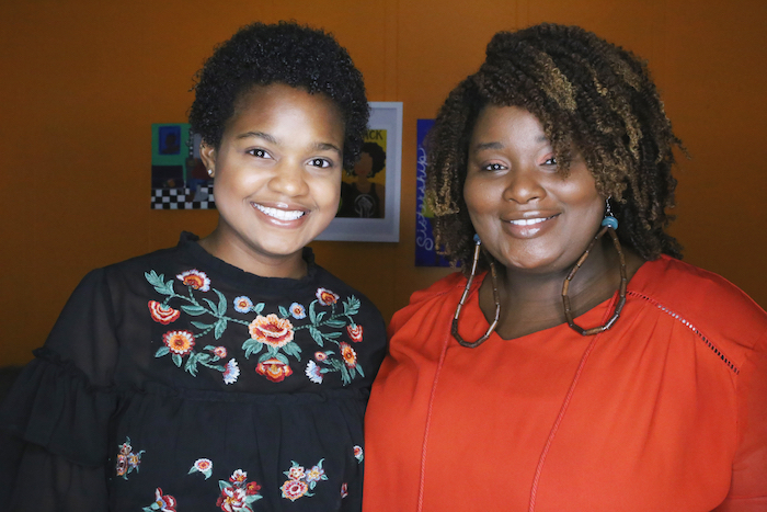 Sixteen-year-old Alexis McCowin, left, wears her hair naturally with hair-care direction from Juanita Henderson, the CEO of Chocolate Kinks & Kurls.