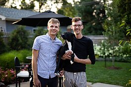 Husbands Kody Tinnel and Cory Allen with their dog Miley.