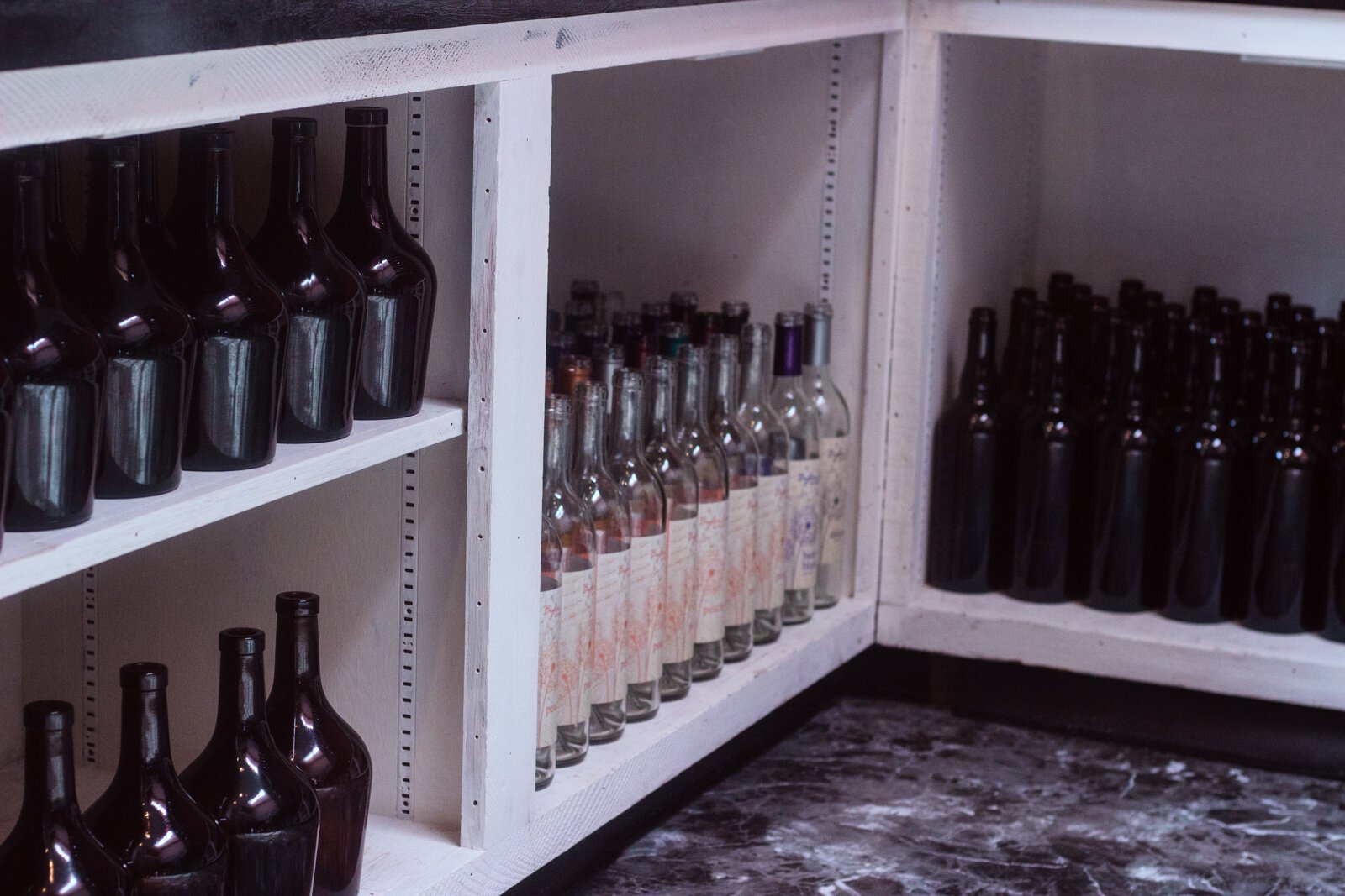Wine bottles, which are not able to be recycled, are given a second life at All the Rage.