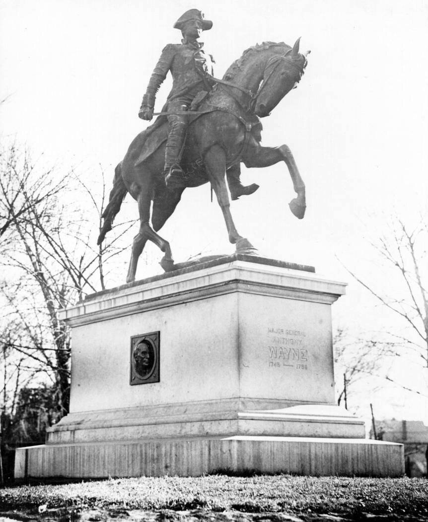 The Gen. Anthony Wayne statue as it originally stood in Hayden Park. The profile of Chief Little Turtle can be seen in the original granite base of the sculpture. The profile of Tecumseh was located on the other side of the base.