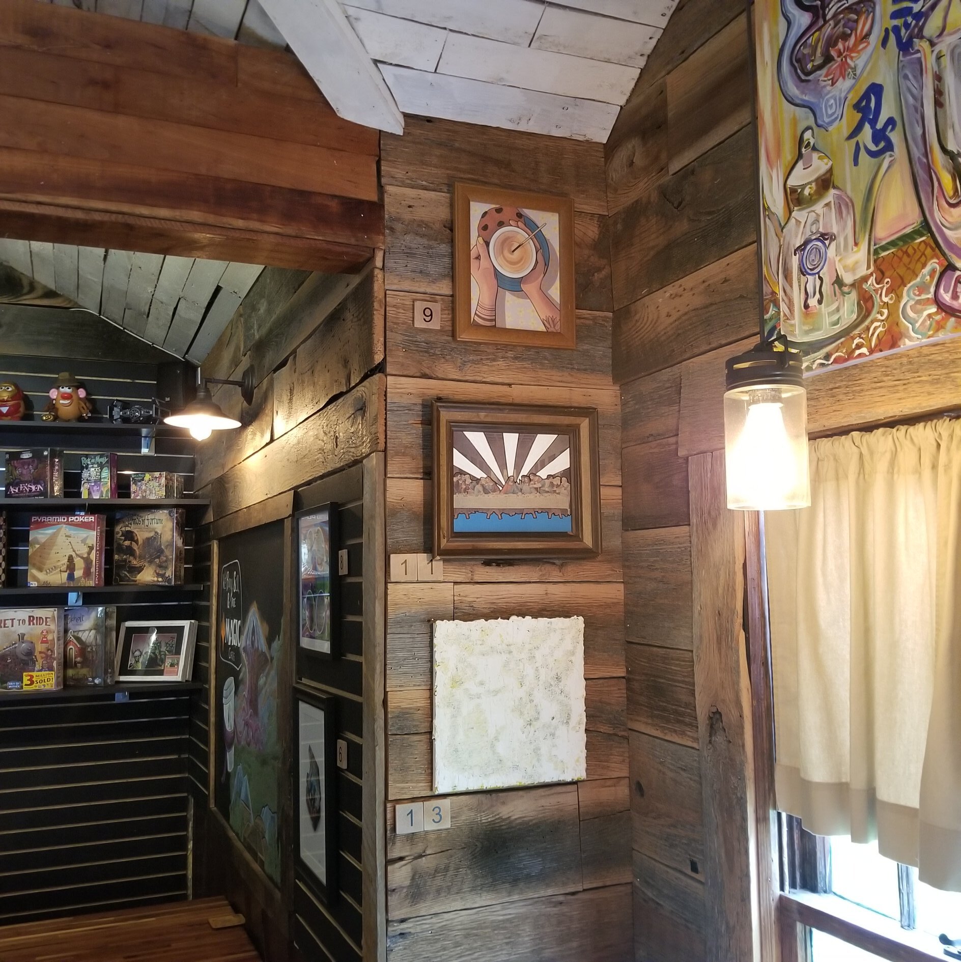 Pearl Street Game & Coffee House in downtown Jeffersonville hosted a art silent auction of local art on its walls to benefit its arts scene and, by extension, its local economy.