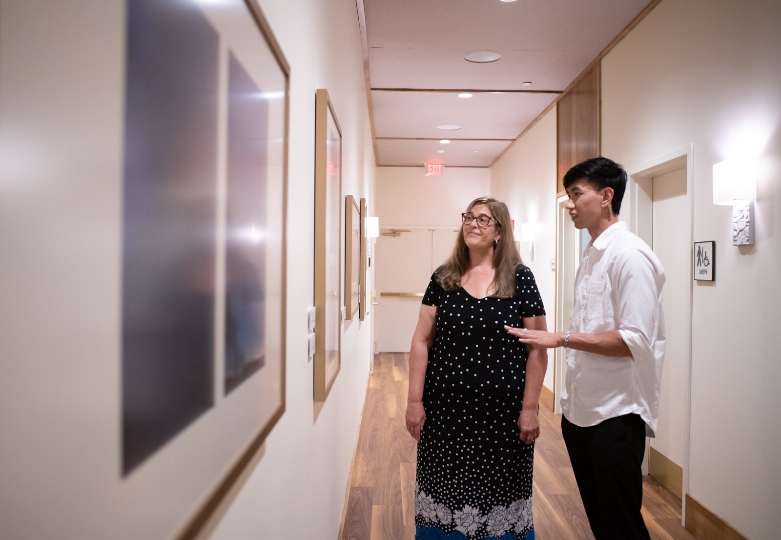 PFW Professor Rebecca Coffman and recent PFW graduate and artist Johnny Min walk through the new revolving gallery featuring work from Purdue Fort Wayne students, alumni and faculty at The Bradley, 204 W. Main St. 
