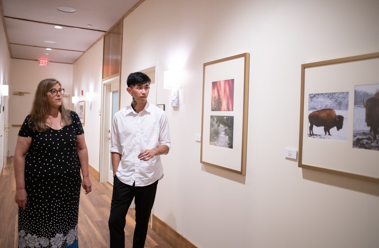 PFW Professor Rebecca Coffman and recent PFW graduate and artist Johnny Min walk through the new revolving gallery featuring work from Purdue Fort Wayne students, alumni and faculty at The Bradley, 204 W. Main St. 