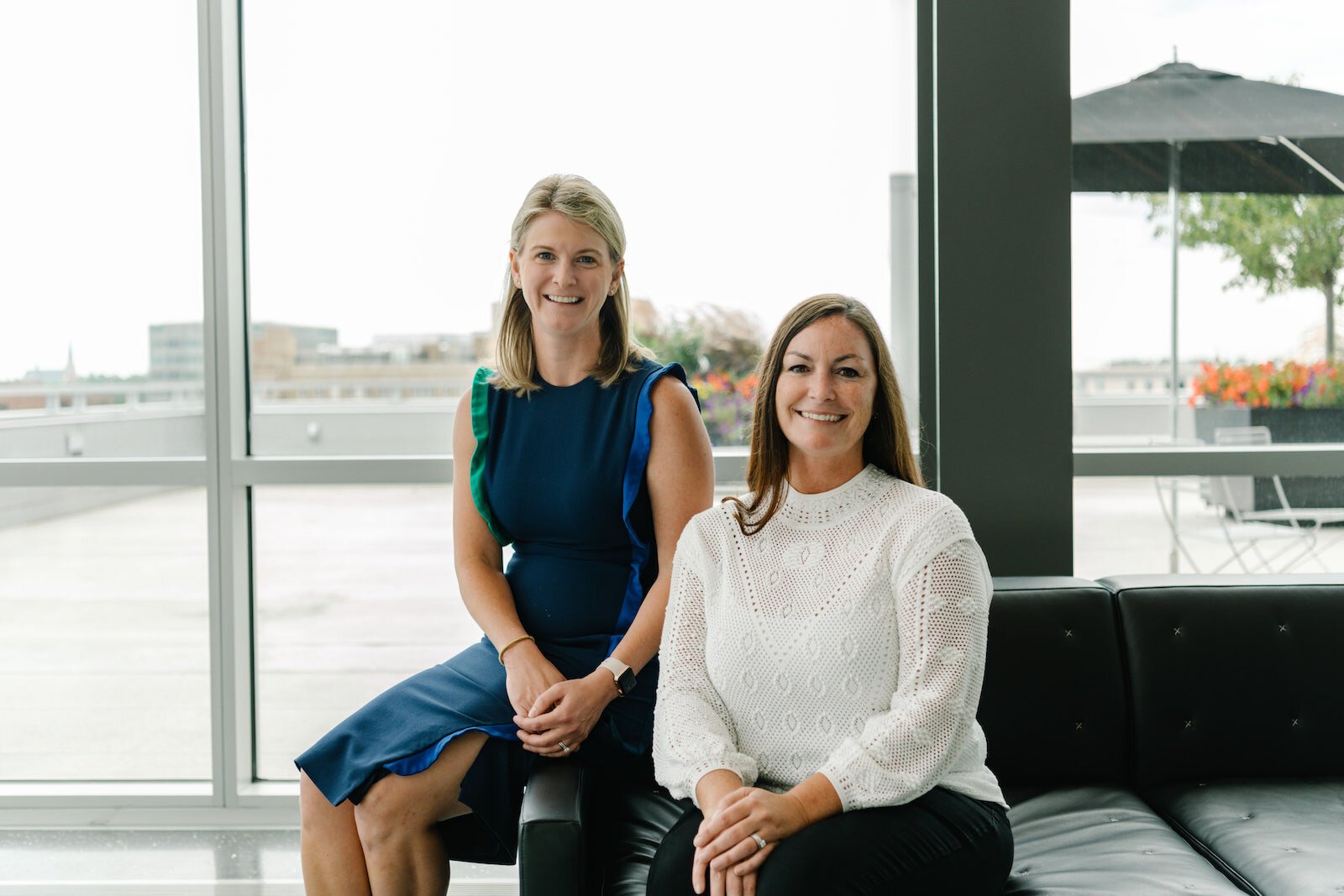Megan Benett, CFO, and Kara Kelley, President and CEO of Asher Agency.