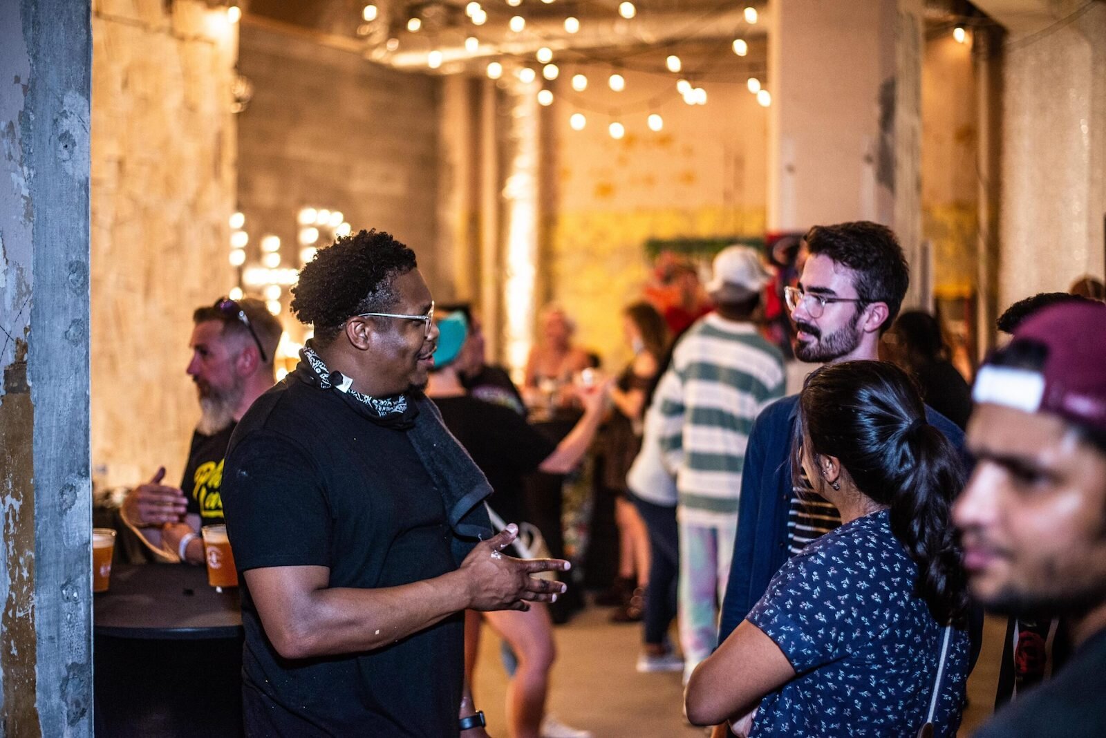 Theoplis Smith III, the artist known as Phresh Laundry, talks with Art Crawl attendees.