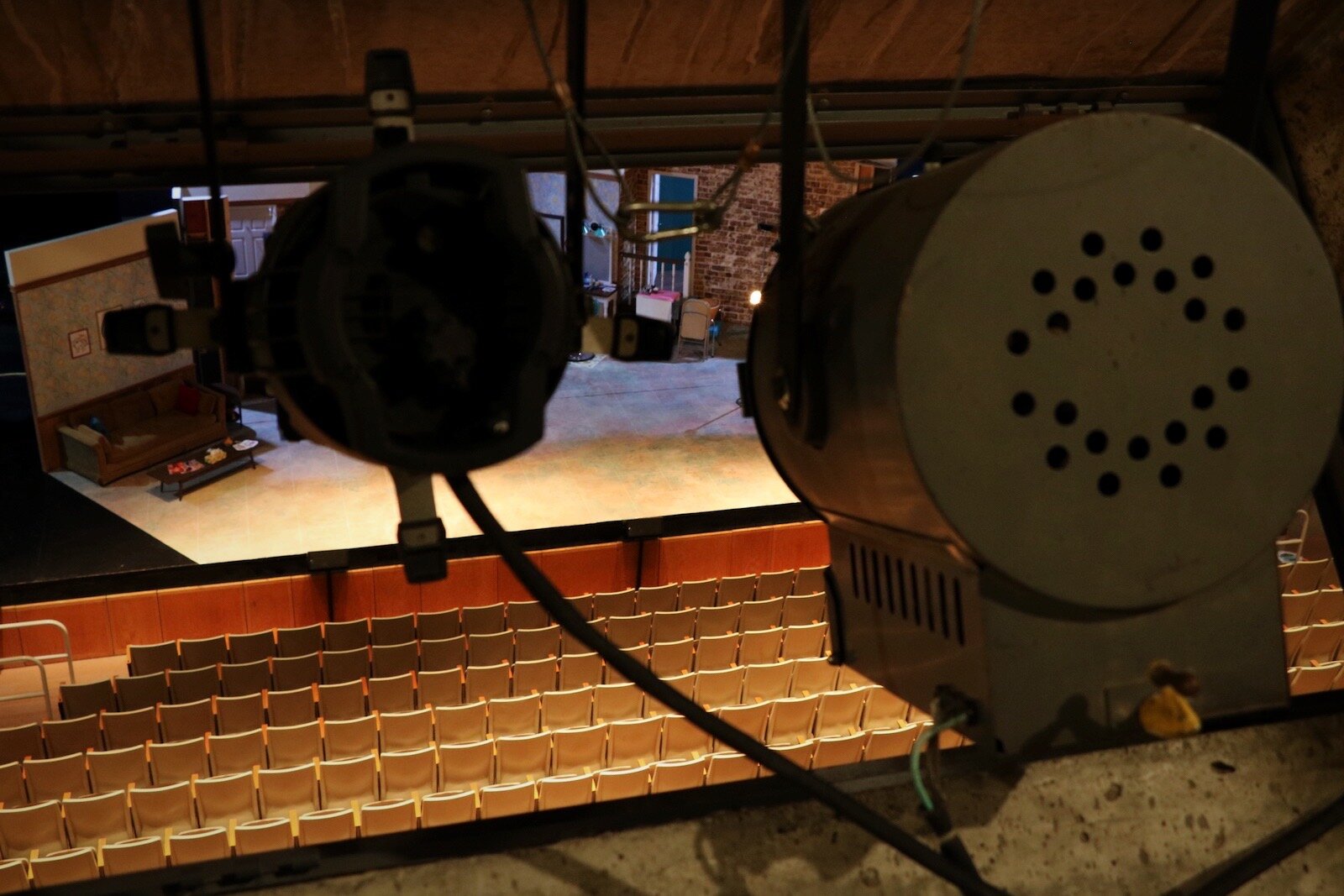 Some of the original lighting, such as the light at right, is still in place at the Arts United Building auditorium. The Arts United Building is set to undergo major upgrades and renovations, including more modern lighting. 