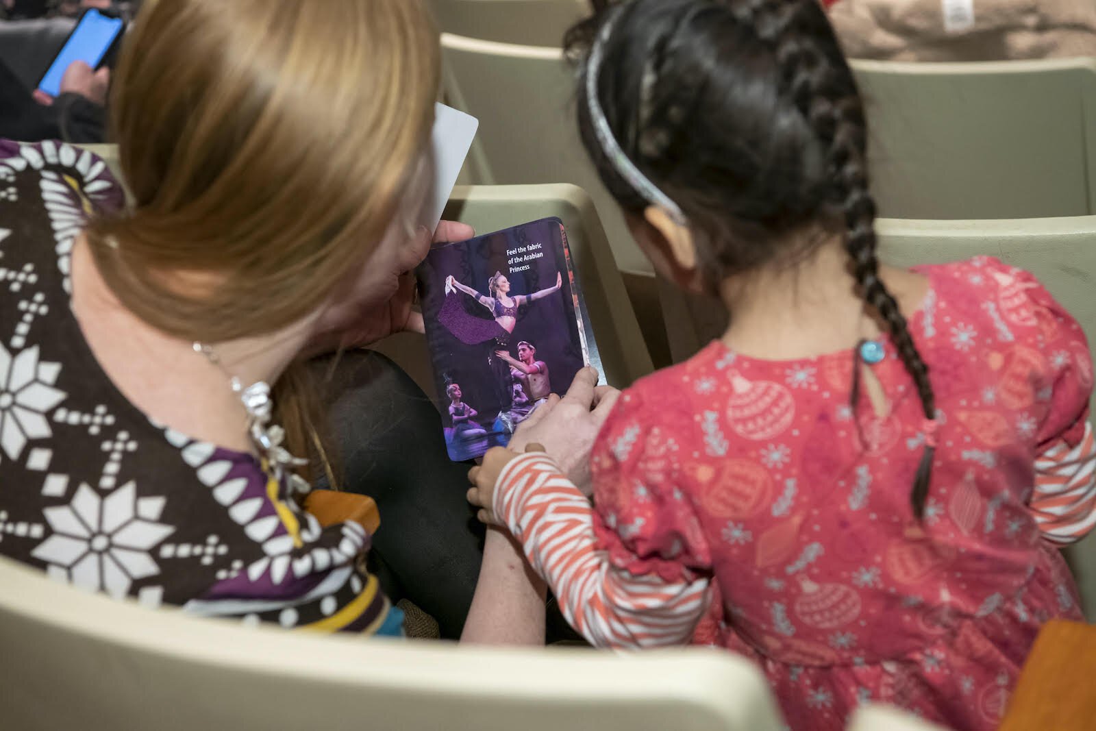 A family explores the sensory cards givens out by the Fort Wayne Ballet.