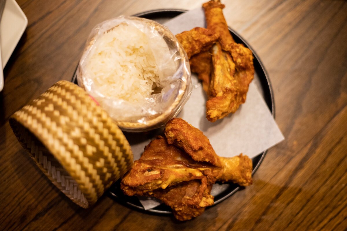 With the papaya salad, you’re given two pieces of extra crispy fried chicken and some sticky rice. 