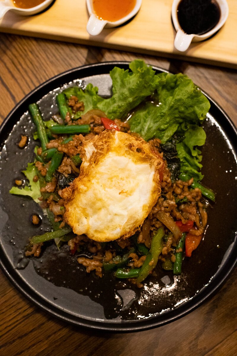 The Main Street Basil Stir-Fry (Pad Kra Prao Minced Meat) is a minced pork stir-fry coated in a sweet, umami-rich sauce that’s infused with anise-y Thai basil.