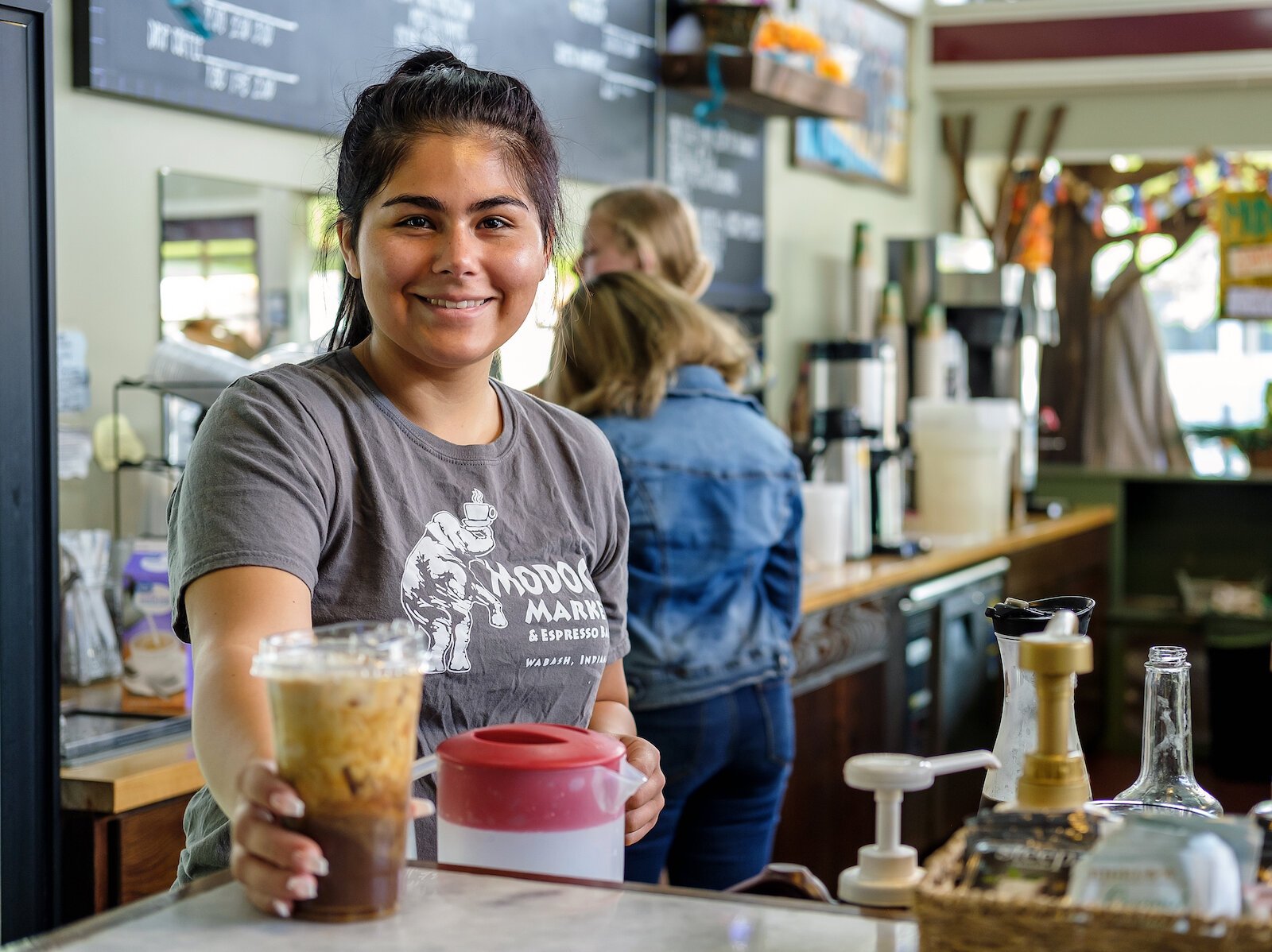 Barista Masyn Zapata serves a drink at Modoc's Market in Downtown Wabash.