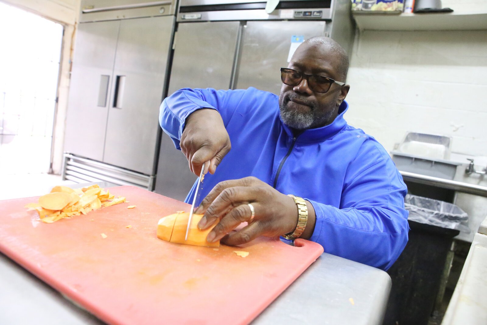 Curry works in his kitchen at Neighborhood Smokehouse.