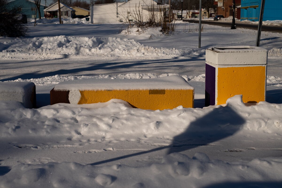 A bench in front of the Truth Mural at 918 E. Pontiac Street.