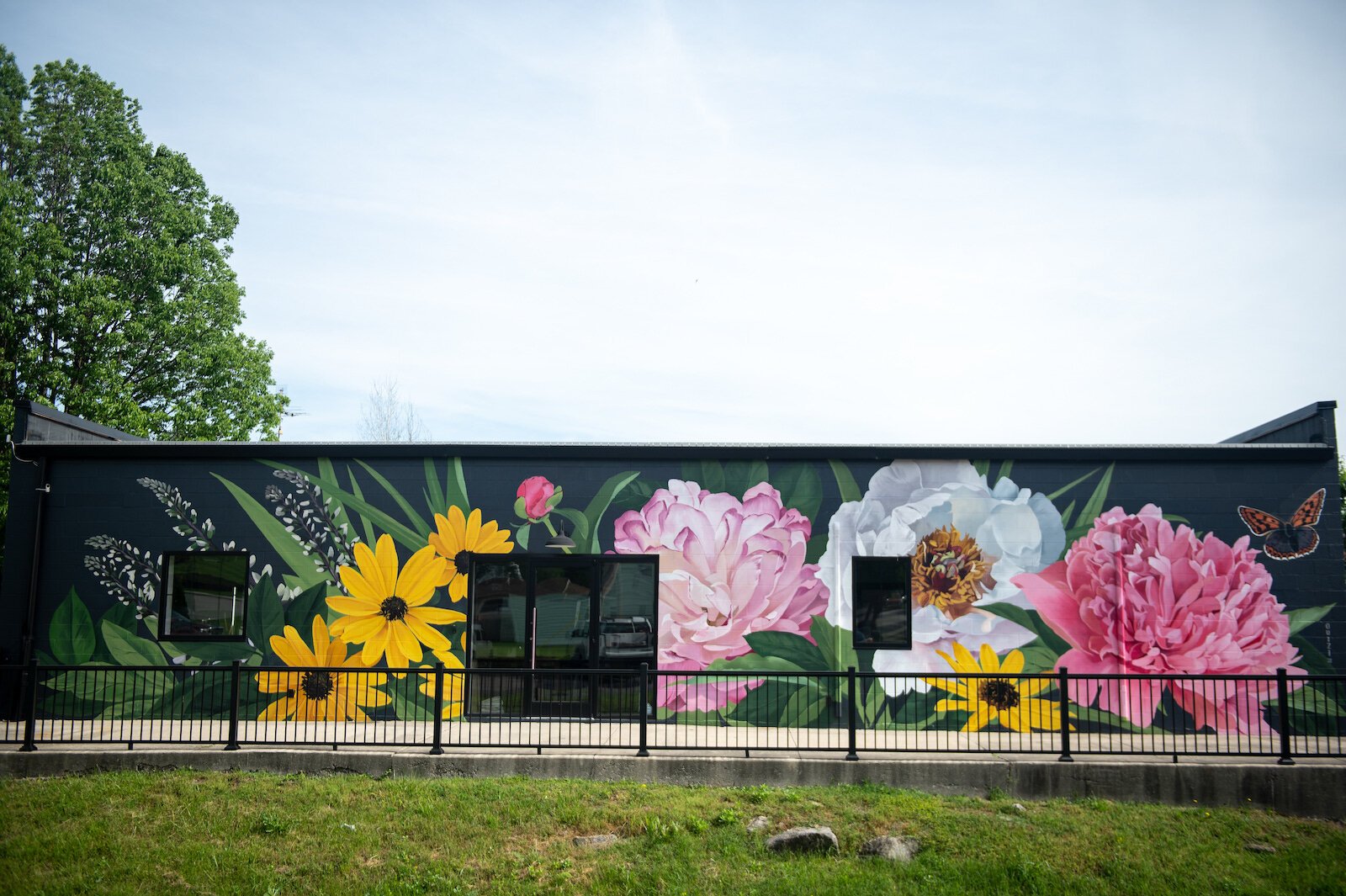 Muralist Louise 'Ouizi' Jones painted the side of Reusser, a digital agency located at 150 S. Main St. in Roanoke.