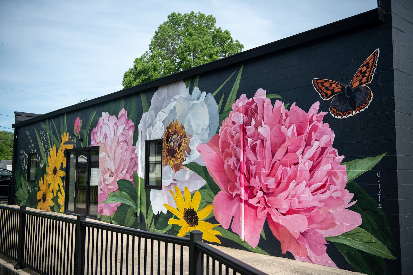 Muralist Louise 'Ouizi' Jones painted the side of Reusser, a digital agency located at 150 S. Main St. in Roanoke.