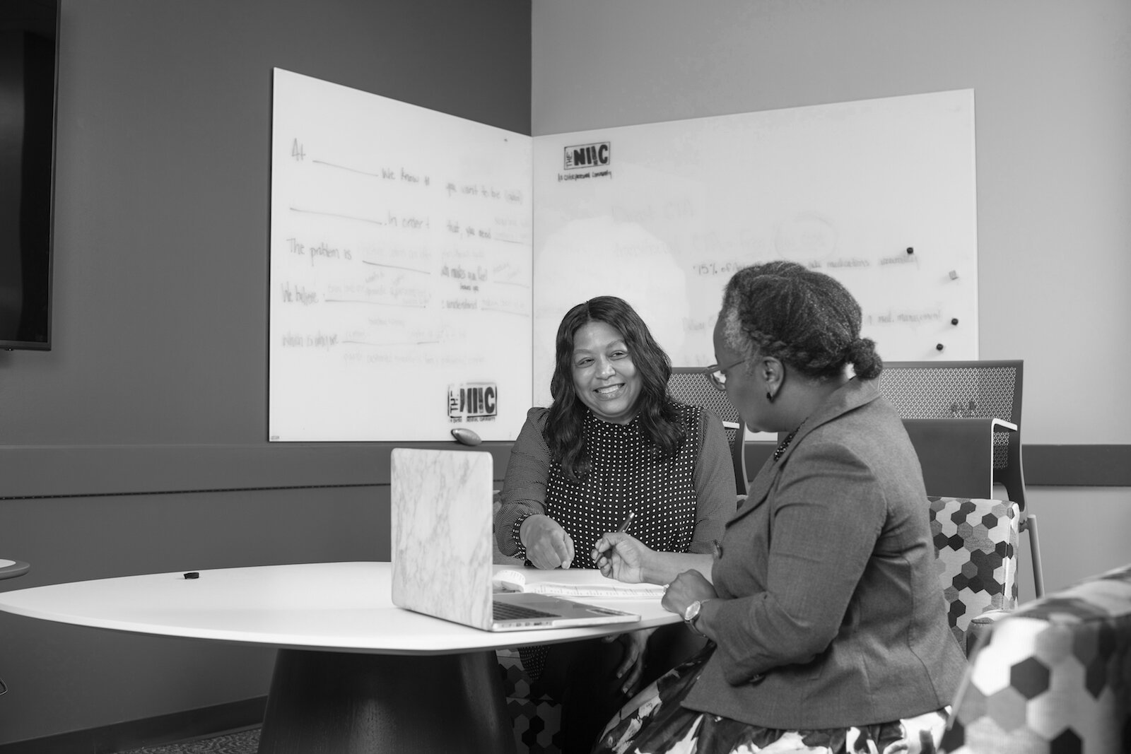 Julie Sanchez, left, coaches potential entrepreneurs at The NIIC.