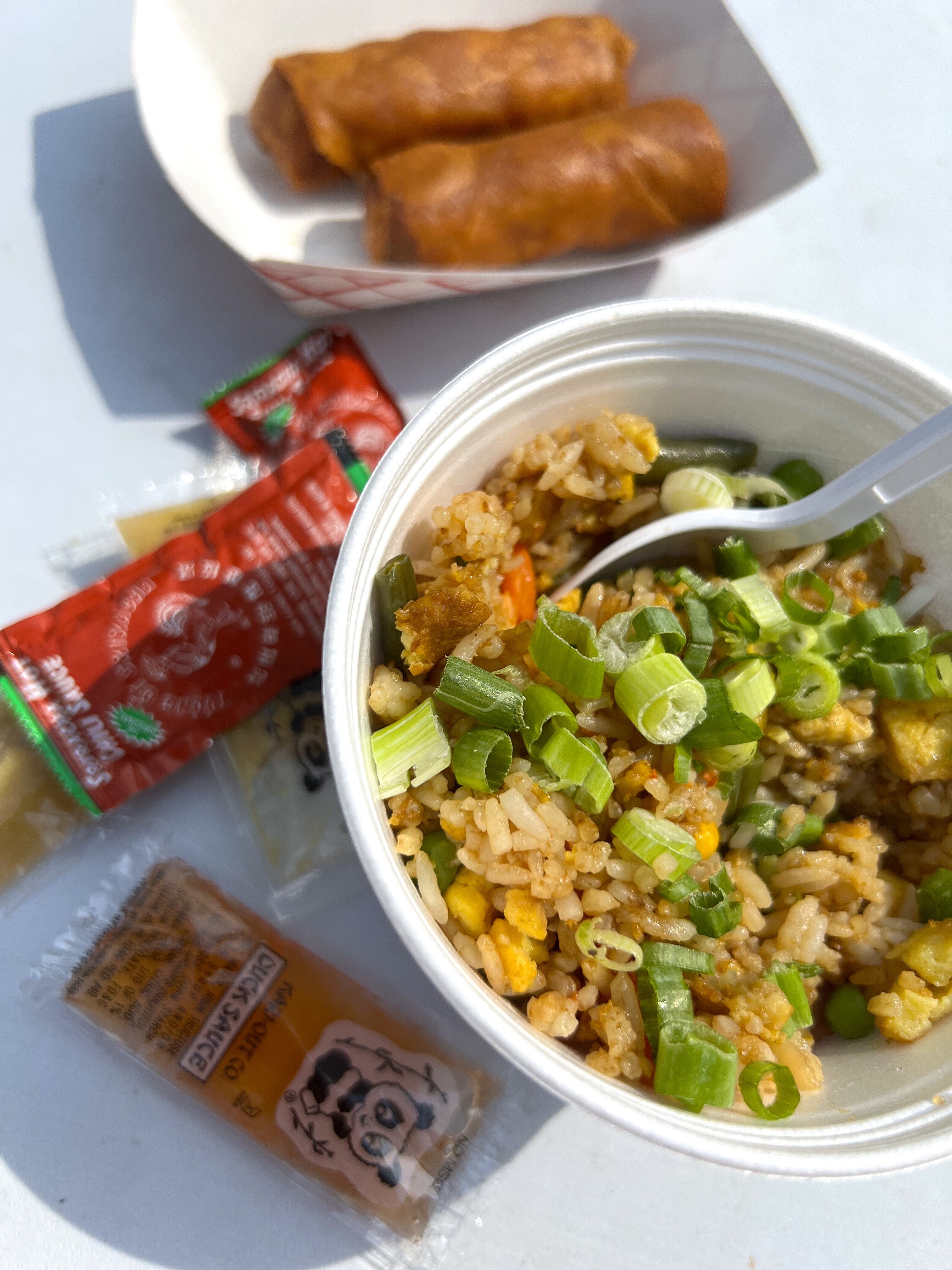 Mac-and-cheese egg rolls, Chinese sausage fried rice, and veggie fried rice from Chau Time.