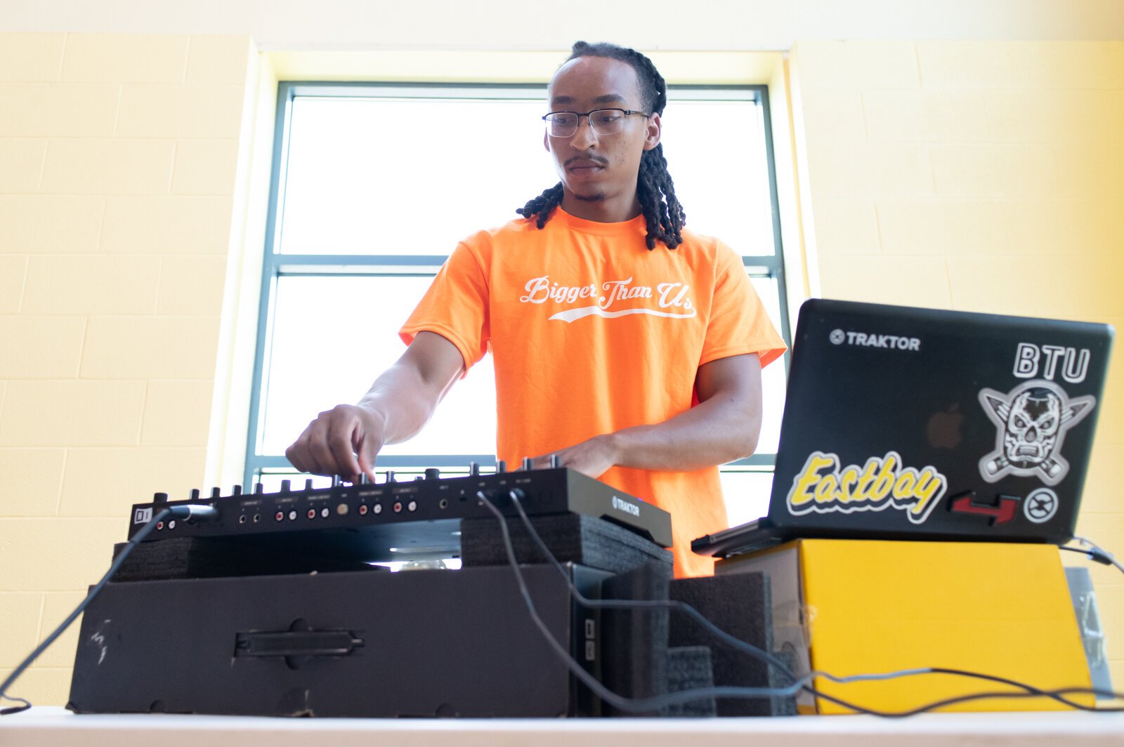 Tyler Whitfield, Vice President of Bigger Than Us, DJs during a Book Bag Giveaway at Renaissance Pointe YMCA, 2323 Bowser Ave.